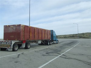Floating construction âbargesâ transported by truck. They bolt together and float on the water to support construction equipment